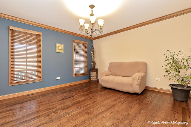 spare room with ceiling fan, wood-type flooring, and ornamental molding