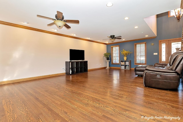 living room featuring hardwood / wood-style flooring, ceiling fan, and ornamental molding