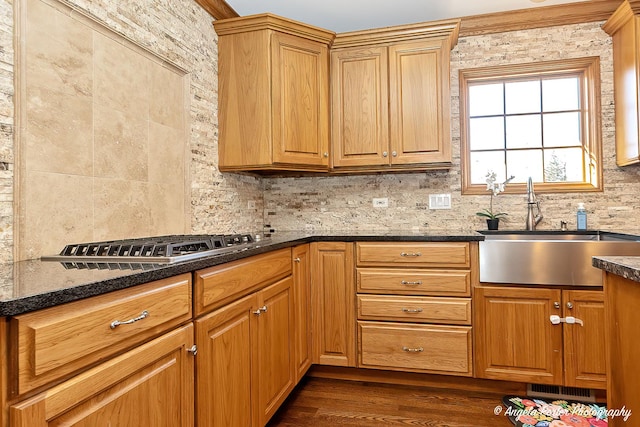 kitchen with pendant lighting, a kitchen island, a kitchen bar, and crown molding