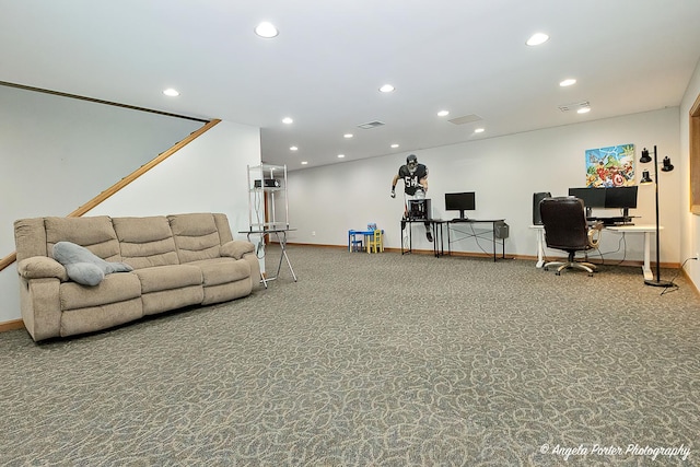 carpeted office space featuring an AC wall unit and a healthy amount of sunlight