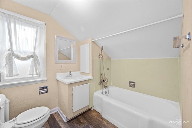 full bathroom with hardwood / wood-style floors, vaulted ceiling, toilet, vanity, and shower / bathtub combination