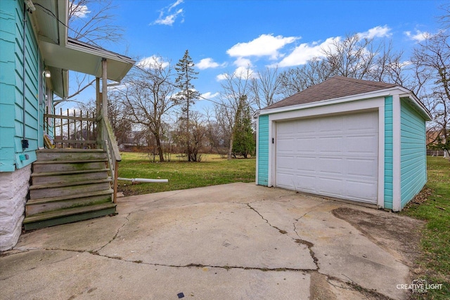 garage featuring a lawn