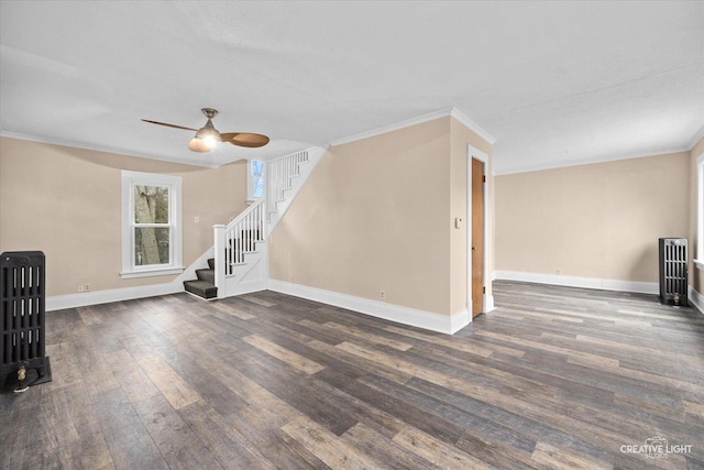 unfurnished living room with ceiling fan, dark hardwood / wood-style flooring, and ornamental molding