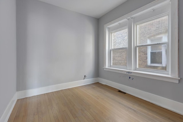 unfurnished room with light hardwood / wood-style flooring