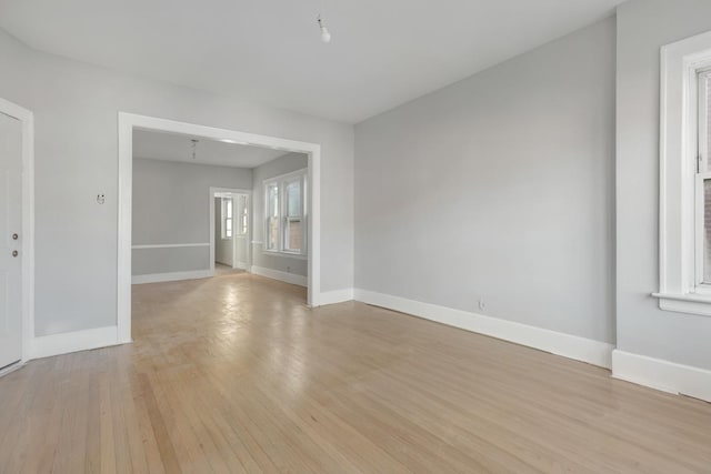 spare room featuring light hardwood / wood-style flooring