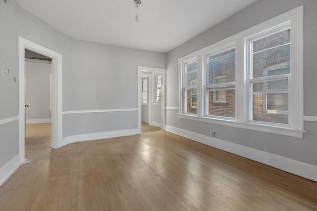 unfurnished room featuring light hardwood / wood-style flooring