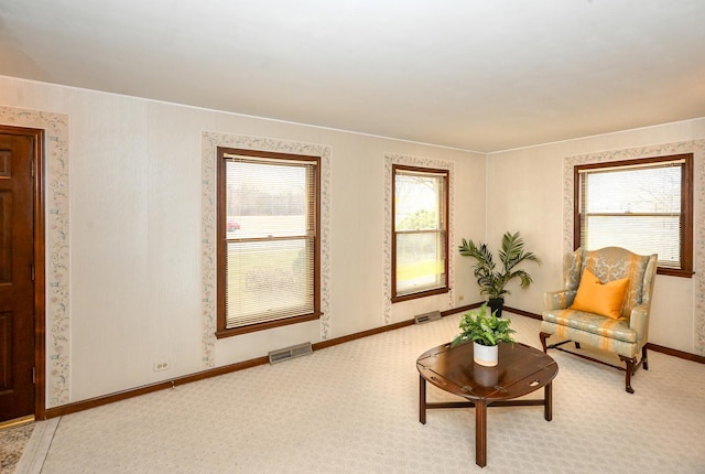 living area with carpet flooring