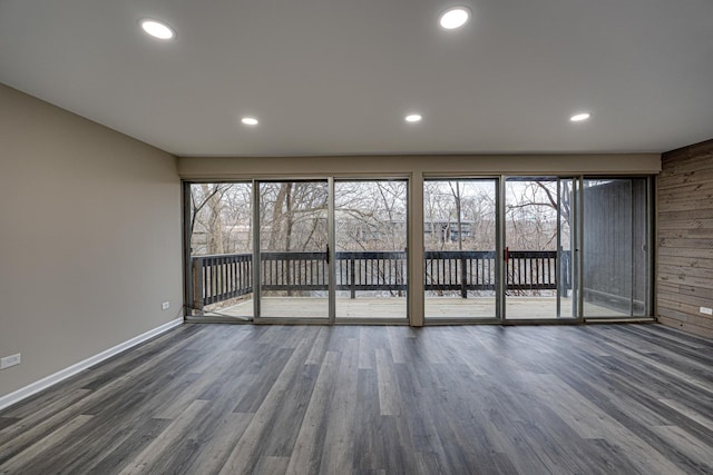 spare room with dark hardwood / wood-style flooring