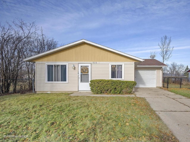 ranch-style house with a garage and a front yard