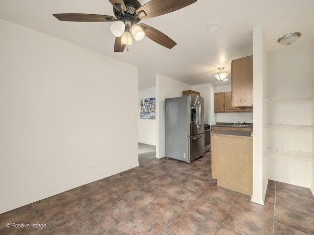 kitchen featuring ceiling fan and appliances with stainless steel finishes