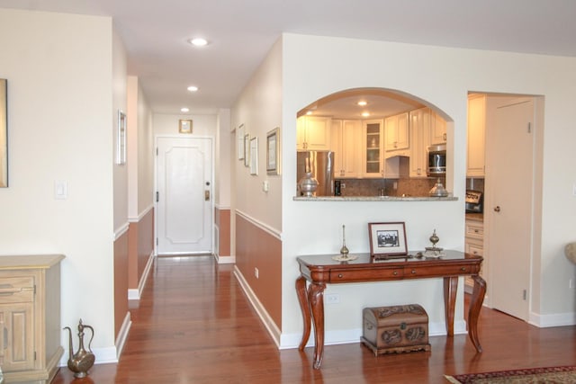 corridor featuring dark hardwood / wood-style floors