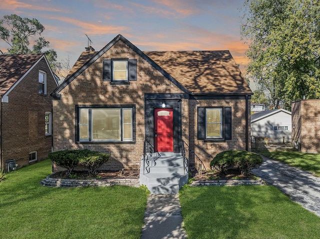 tudor house featuring a yard