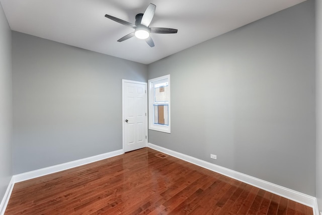 spare room featuring wood-type flooring and ceiling fan