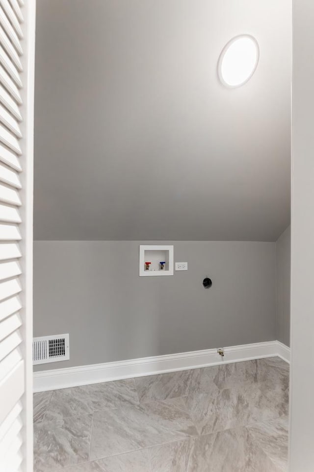 clothes washing area featuring hookup for a gas dryer, washer hookup, and hookup for an electric dryer