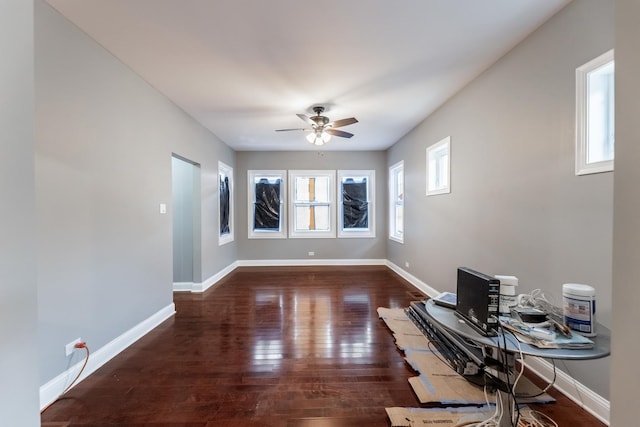 spare room featuring dark hardwood / wood-style floors and ceiling fan