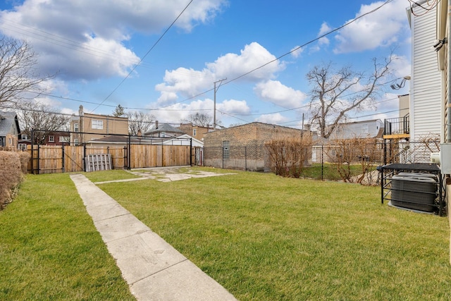 view of yard featuring central AC