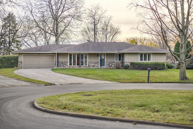 single story home with a garage and a front yard