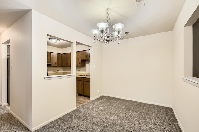 interior space with carpet and a notable chandelier