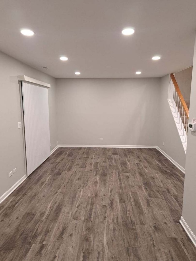 basement featuring dark hardwood / wood-style floors