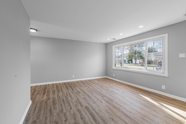 spare room featuring hardwood / wood-style floors