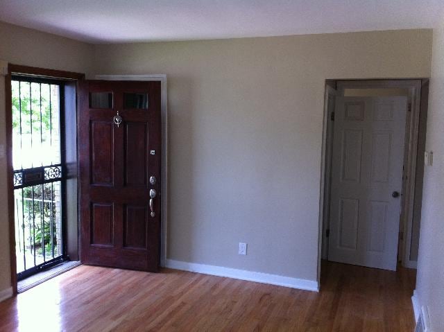 foyer entrance with hardwood / wood-style floors