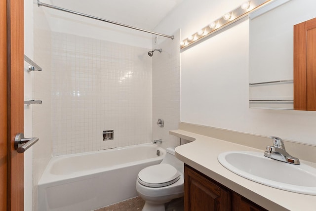 full bathroom featuring vanity, toilet, and tiled shower / bath combo