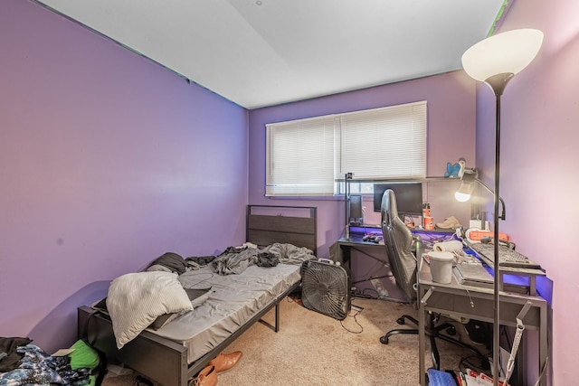 bedroom with carpet and vaulted ceiling