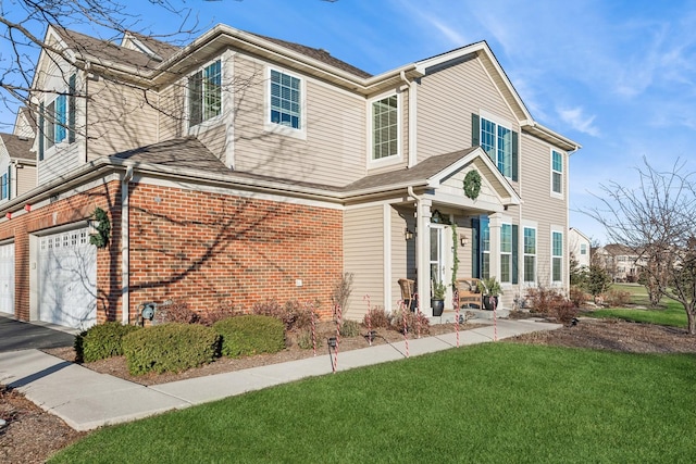 view of front of property with a front yard and a garage