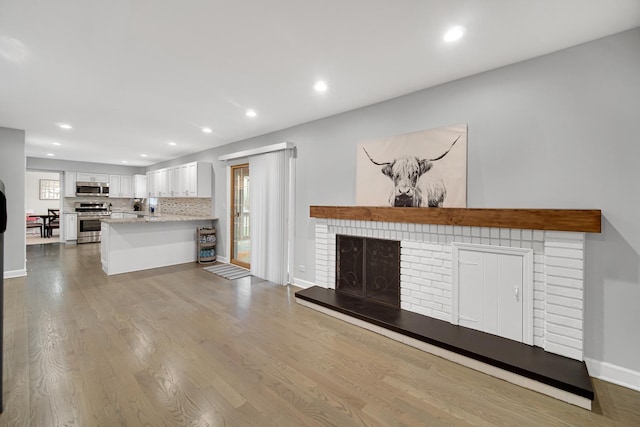 unfurnished living room with light wood-type flooring