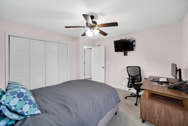 bedroom with light carpet, a closet, and ceiling fan