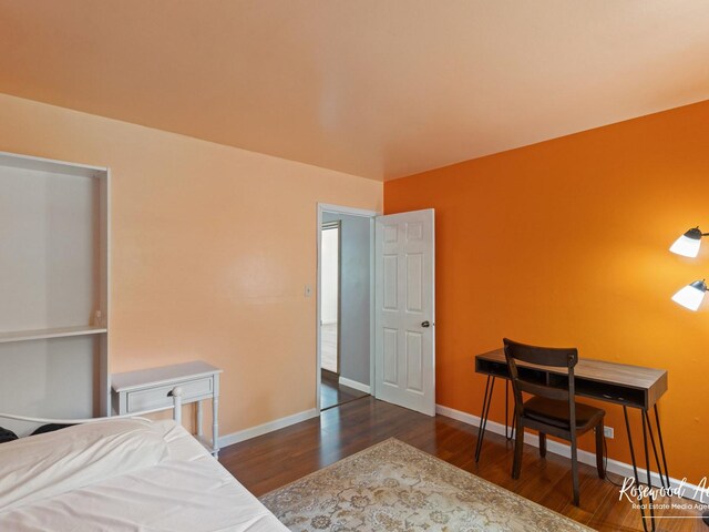 bedroom featuring dark hardwood / wood-style flooring