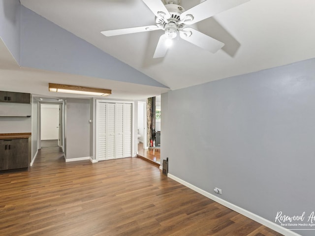 unfurnished living room with ceiling fan, lofted ceiling, and hardwood / wood-style flooring