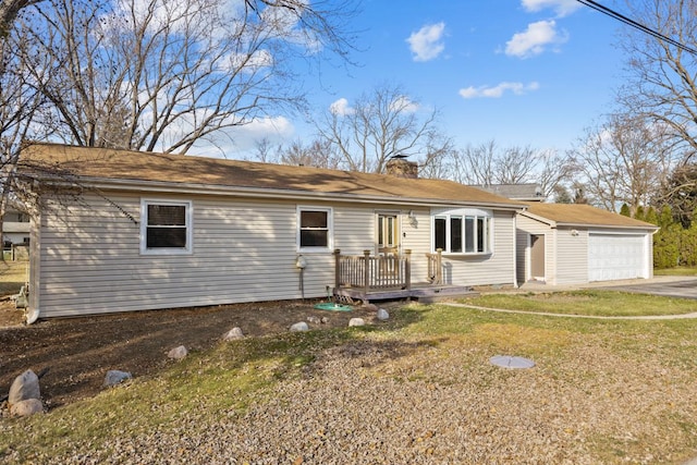 ranch-style home with a front yard and a garage