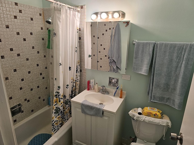 full bathroom featuring vanity, toilet, and shower / tub combo with curtain