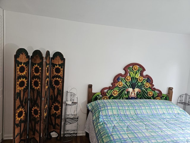 bedroom with wood-type flooring