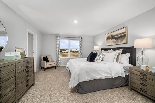 bedroom with light carpet