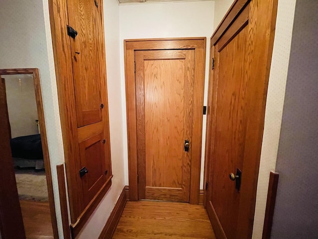 doorway with light wood-type flooring