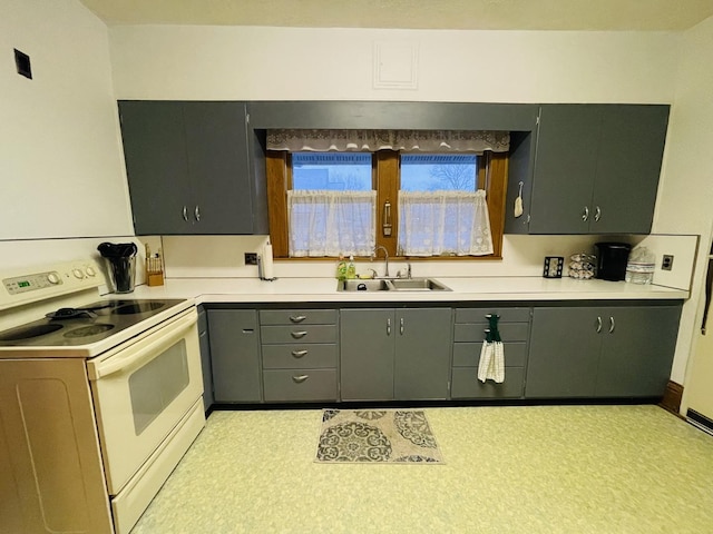 kitchen featuring white electric range and sink