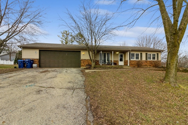 ranch-style house featuring a garage