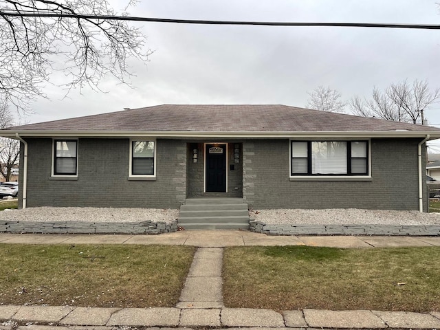 view of front of home with a front lawn