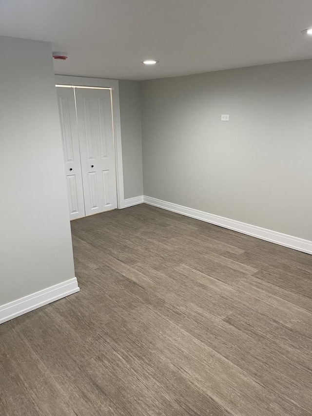 empty room with dark wood-type flooring