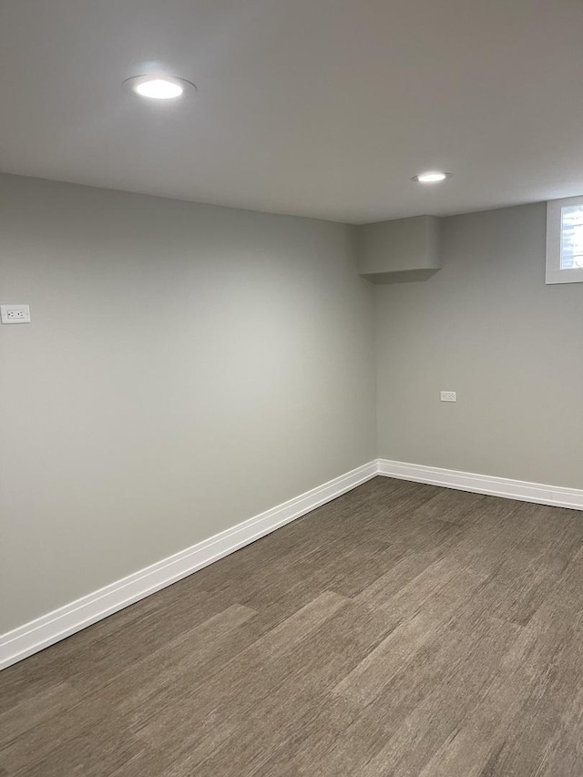 basement featuring dark wood-type flooring