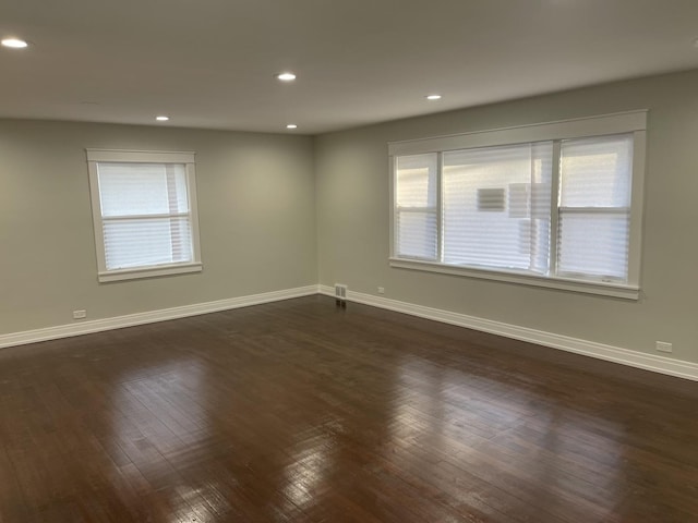 unfurnished room featuring dark wood-type flooring