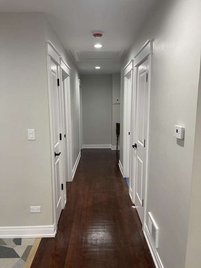 hall featuring dark wood-type flooring