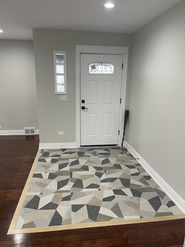 foyer entrance featuring dark hardwood / wood-style flooring