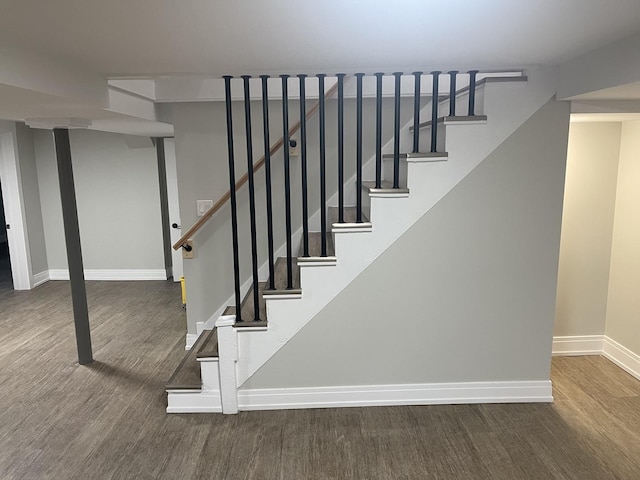 staircase featuring hardwood / wood-style flooring