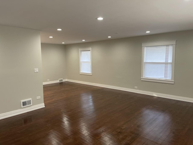 unfurnished room featuring dark hardwood / wood-style floors