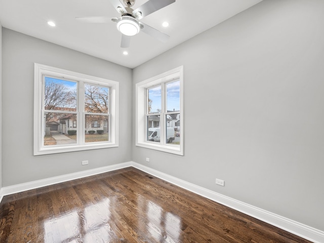 unfurnished room featuring ceiling fan and dark hardwood / wood-style flooring