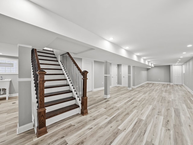 basement featuring light hardwood / wood-style flooring