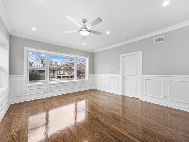 interior space with hardwood / wood-style flooring, ceiling fan, and ornamental molding